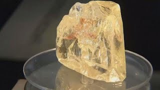 Sierra Leones Peace Diamond sells for 65 million at auction [upl. by Fairley991]